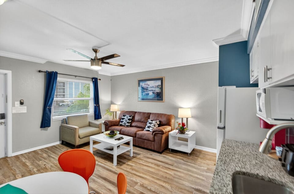 Spacious living room w/ seating, dining area, and a relaxed, homey feel throughout.