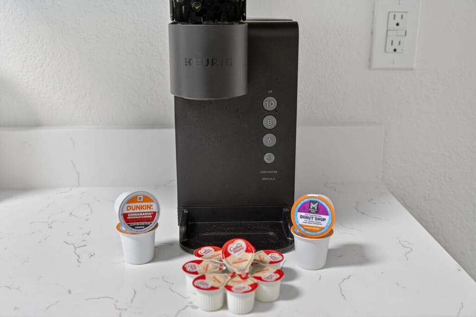 Convenient coffee setup w/ pod machine & mugs ready for an easy morning brew