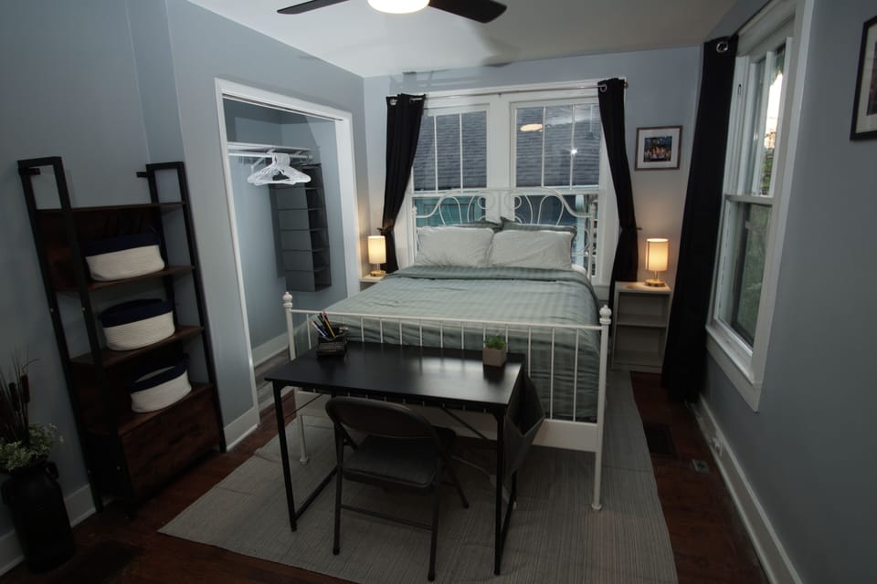 Bedroom featuring built-in closet & shelving unit for ample storage!