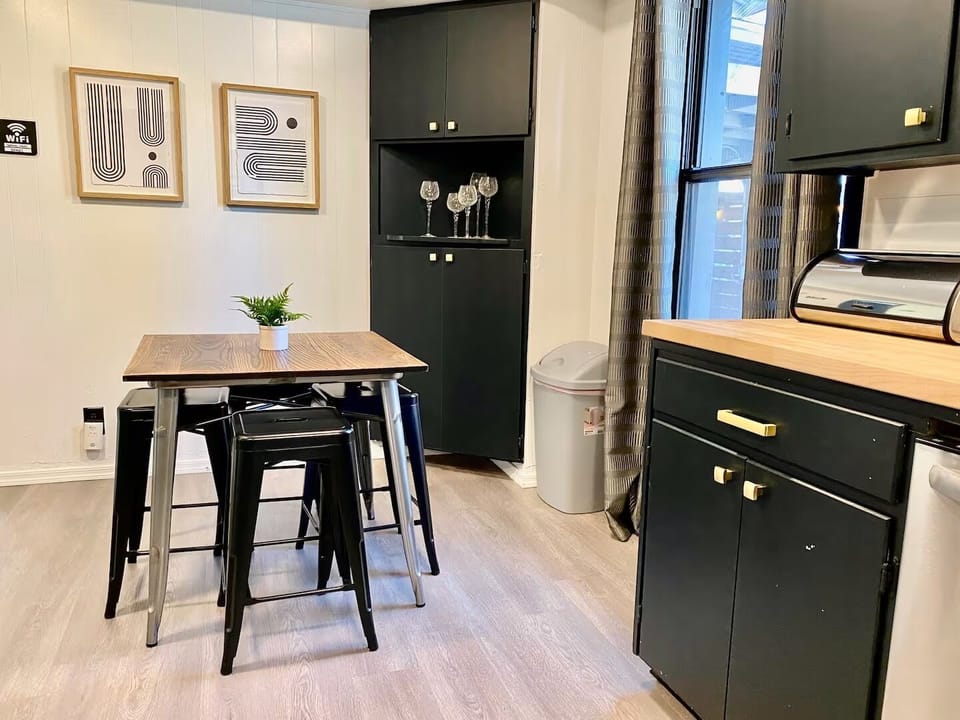 Modern kitchen, cozy dining vibes.