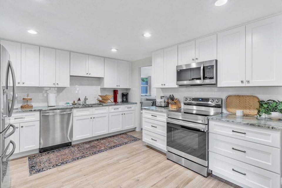 The kitchen is an open space with lots of countertop room for you to prepare meals on. The dishwasher helps make clean up a breeze!
