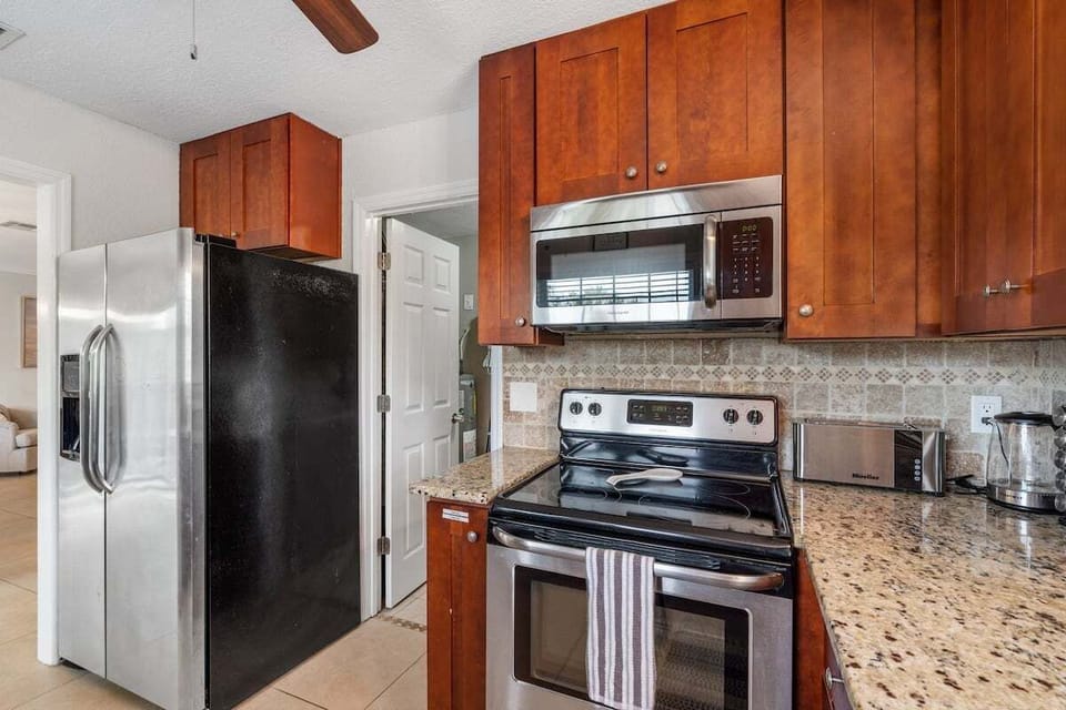 There is plenty of countertop space for preparing all of your favorite dishes!  (Kitchen Cabinets are now painted white)