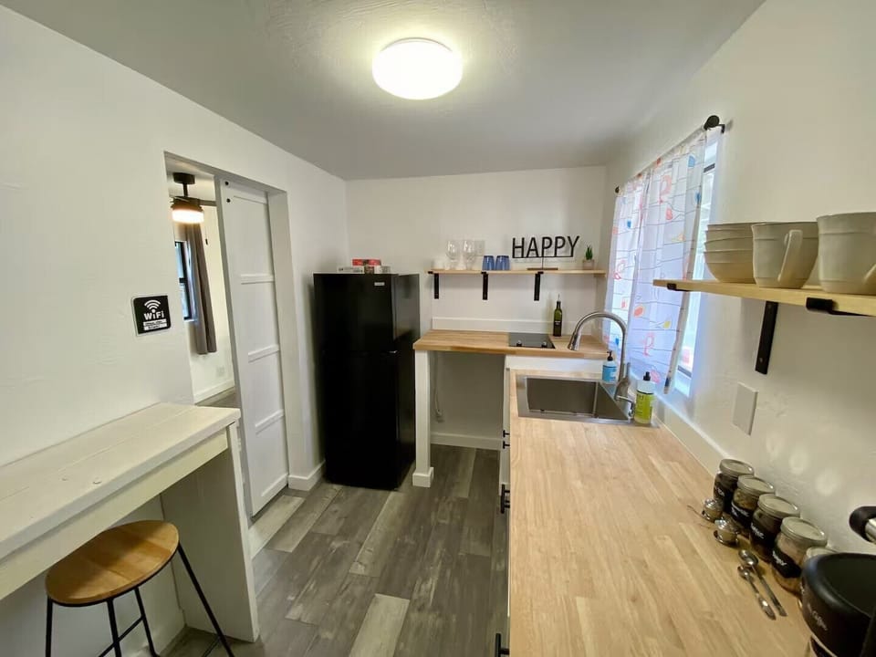 Bright kitchenette with cooktop, prep space, and everything you need