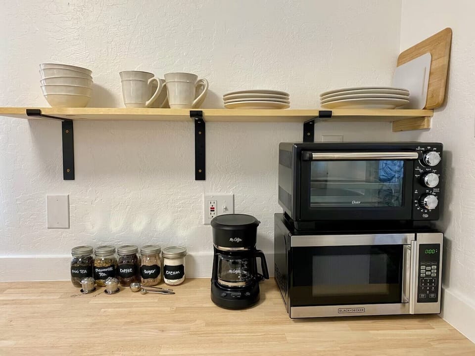 Fully stocked kitchen with coffee and tea bar.