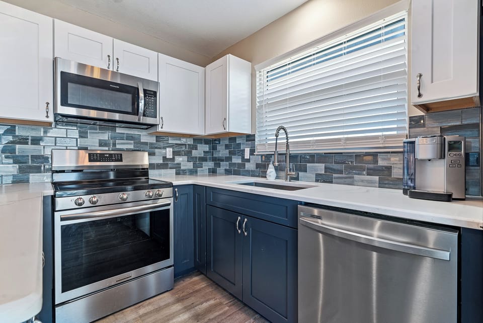 The kitchen is a stylish and functional space designed for effortless vacation living.