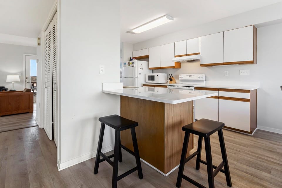 Prepare your favorite coastal dishes in the well-stocked kitchen featuring modern appliances and plenty of counter space.