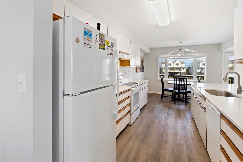 Prepare your favorite coastal dishes in the well-stocked kitchen featuring modern appliances and plenty of counter space.