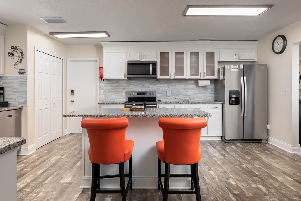 This granite-topped kitchen island pops with personality and invites casual connection