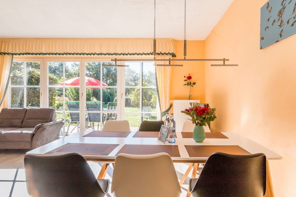 Bright Living Room with Dining Table and Sofa