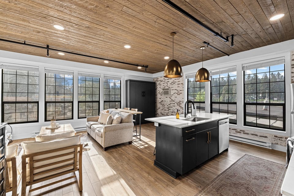Kitchen island- living room- queen murphy bed (black) on the back wall upstairs