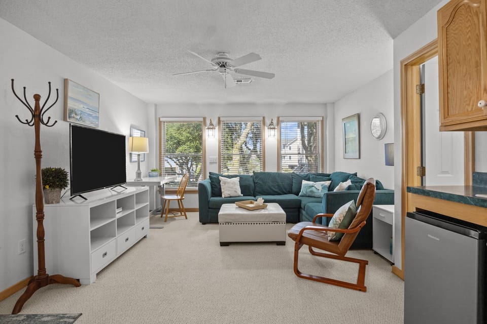 Mid Level Den with comfortable seating, TV and kitchenette 
