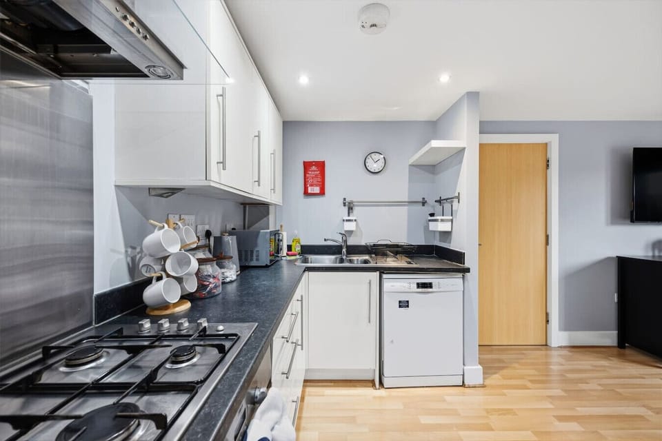 A modern, fully equipped kitchen featuring quality appliances and all the essentials for easy home dining.