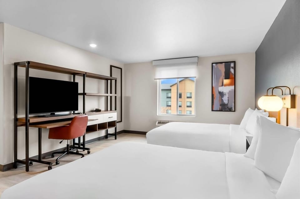 Wake up refreshed with sunlit views and plush white bedding.