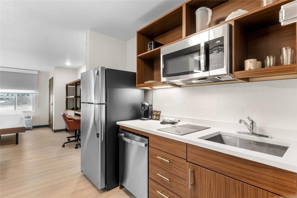 Stock snacks and dine in with an airy open-plan kitchenette.