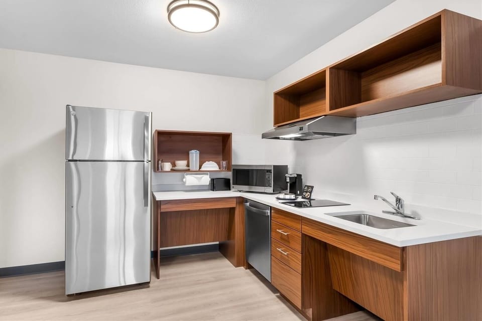 Cook easy meals in this sleek, bright, modern kitchenette.