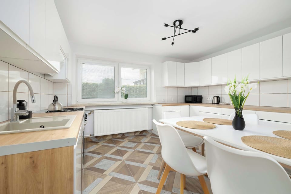 The kitchen's contemporary decor complements the apartment's style.