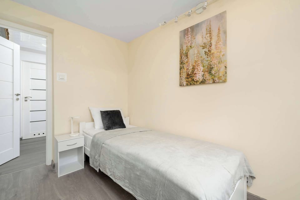 The bedrooms' modern amenities ensure a comfortable stay.