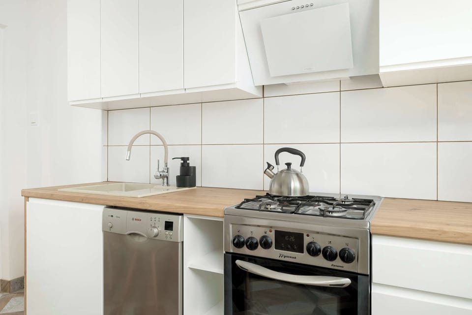 The kitchen offers a functional layout for convenient cooking.