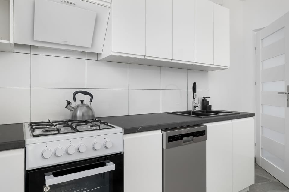 The kitchen's stylish decor complements the apartment's overall design.