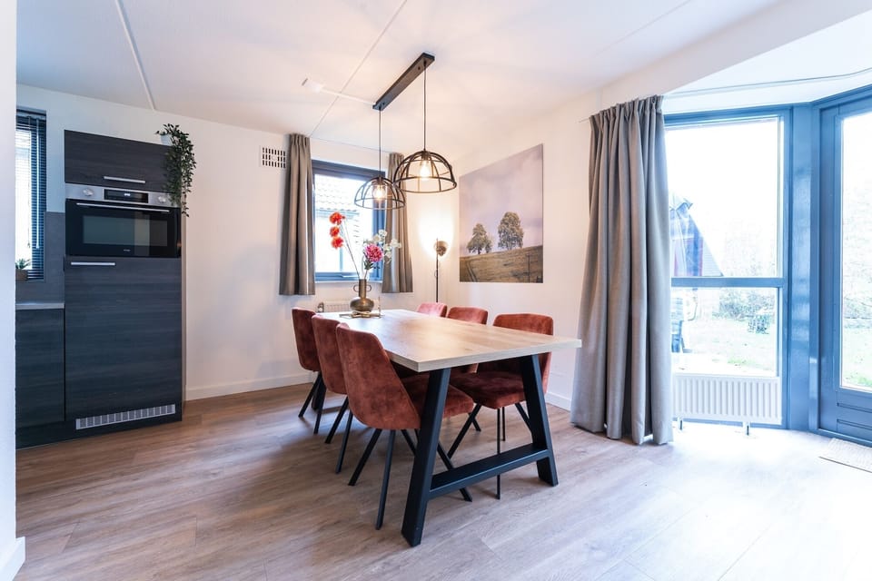 Dining room with large family table at Groenenheuvels House — ideal for shared meals and longer holiday stays in Holiday Park Groene Heuvels.
