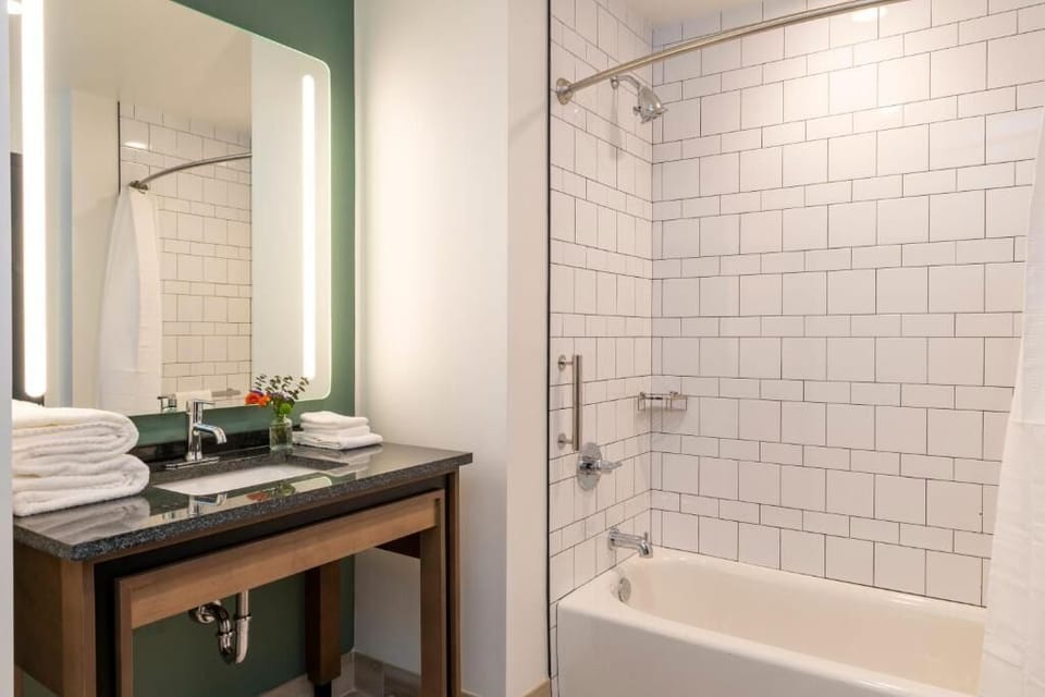 Refresh easily in a bright bath with spa-like lighting.