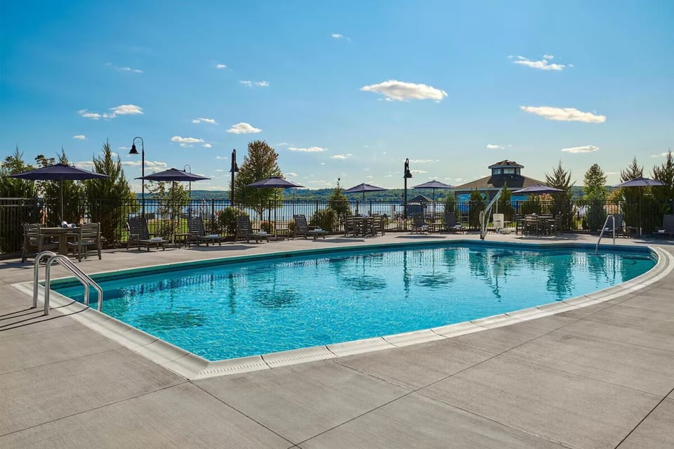 Dive into a bright, spacious pool with lakeside views.