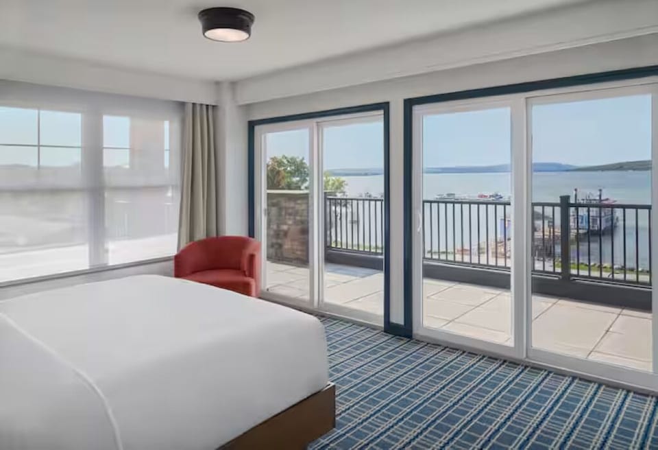 Wake up to sunlit mornings and sweeping waterfront terrace views.