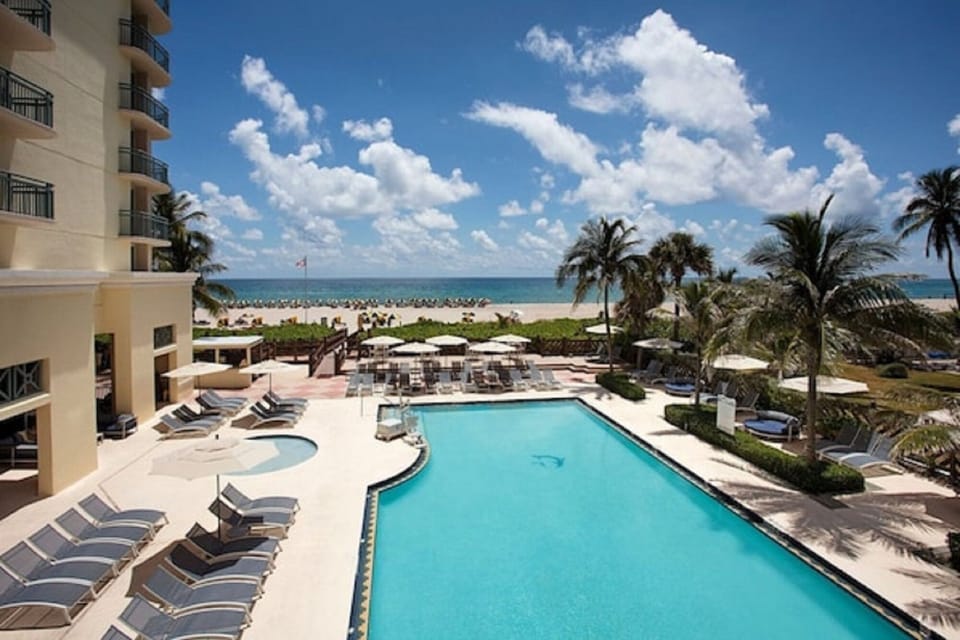 Dive into sparkling pool bliss with sweeping ocean views.