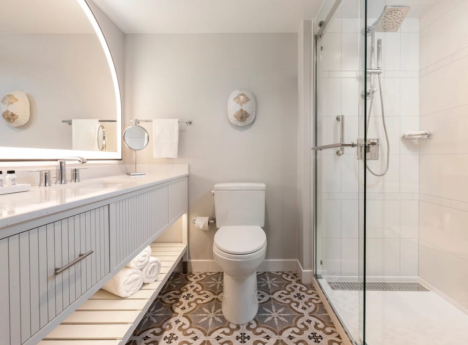 Step into a glass shower with bright, refreshing space.