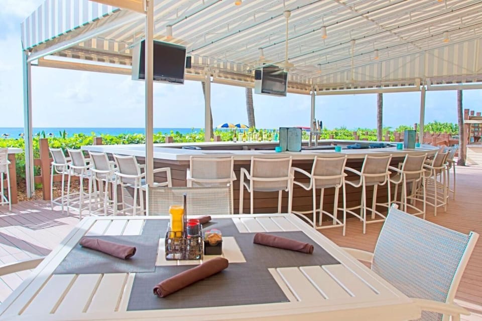 Linger longer with shaded seating and wide-open seaside views.