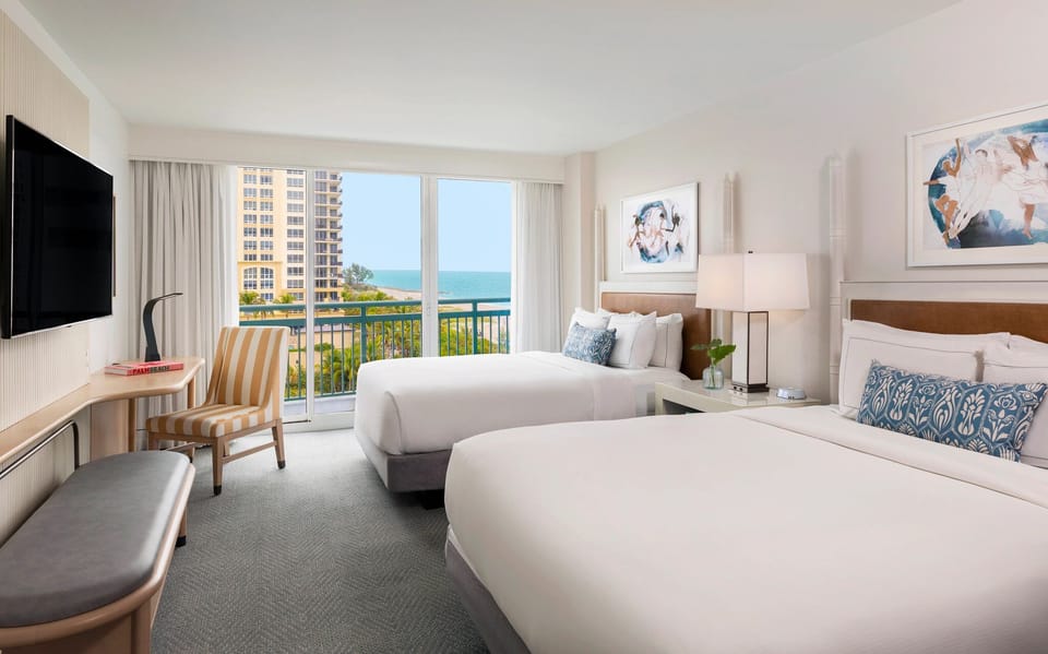 Gather with friends in a spacious room with breezy balcony.