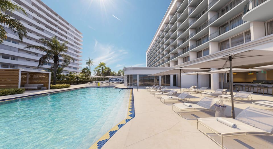 Lounge in comfort with umbrellas, towels, and breezy skies.