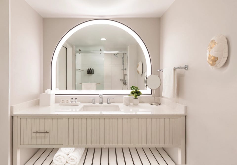 Start your day at the glowing mirror with roomy vanity.