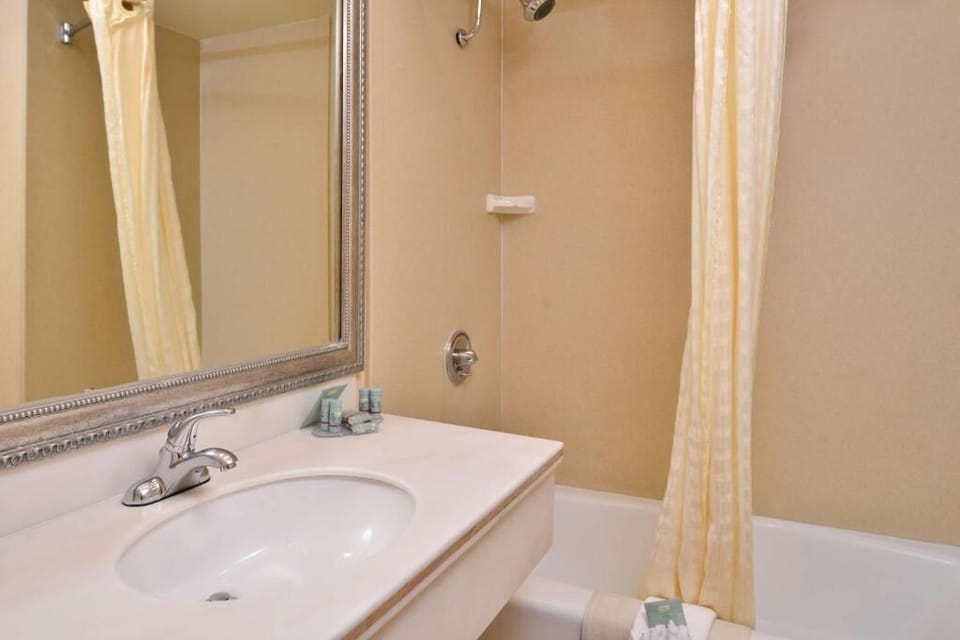 Freshen up in a bright bath with tub-shower combo.