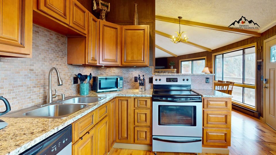 Fully equipped kitchen with updated appliances and everything needed for easy home-cooked meals.