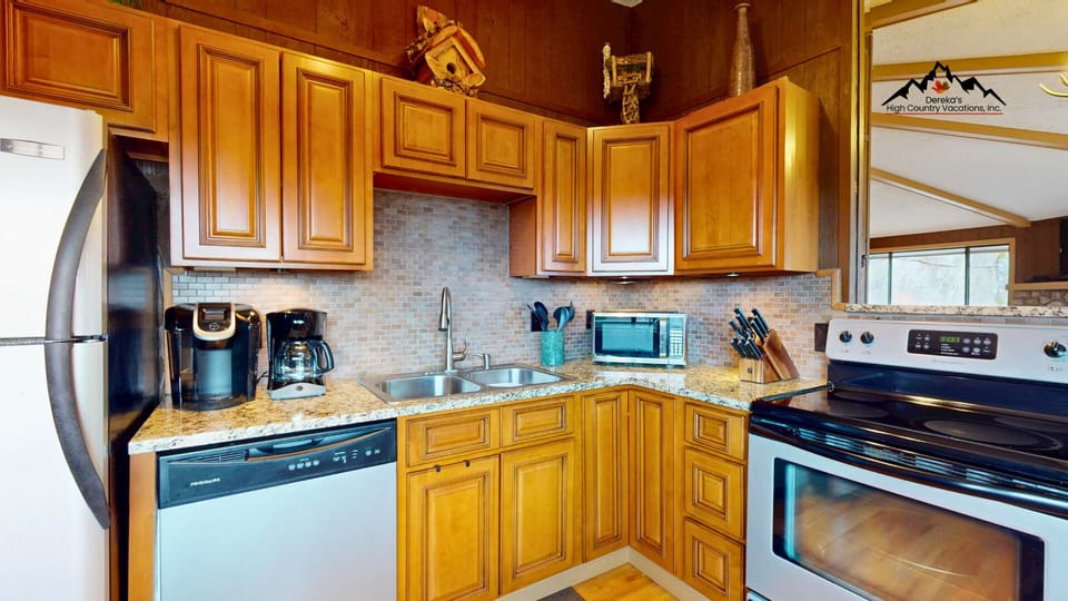 Open-concept kitchen flowing seamlessly into the living area, perfect for gathering and entertaining.