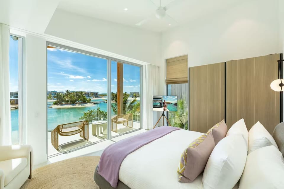 Wake to turquoise lagoon views from your plush king bed.