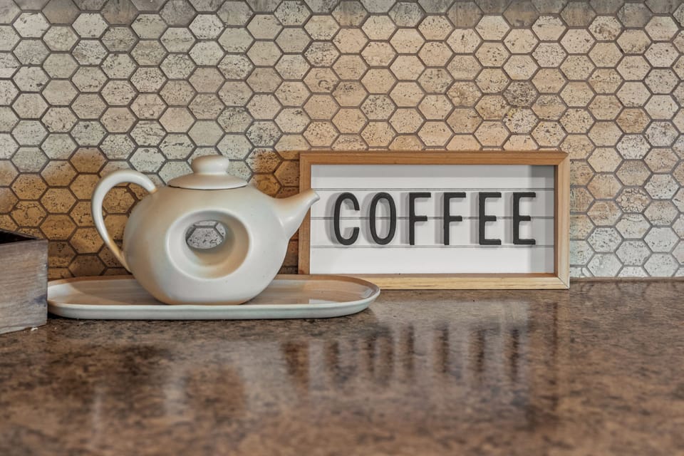 Savor your morning brew amidst stylish decor and charming hexagon tiles!