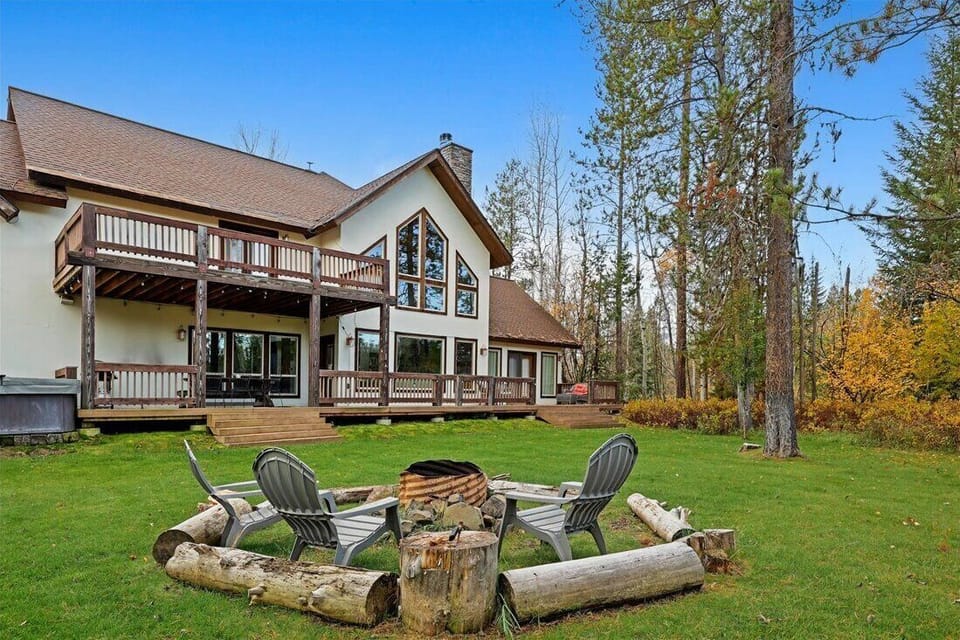 Gather by the firepit under the stars with forest views.