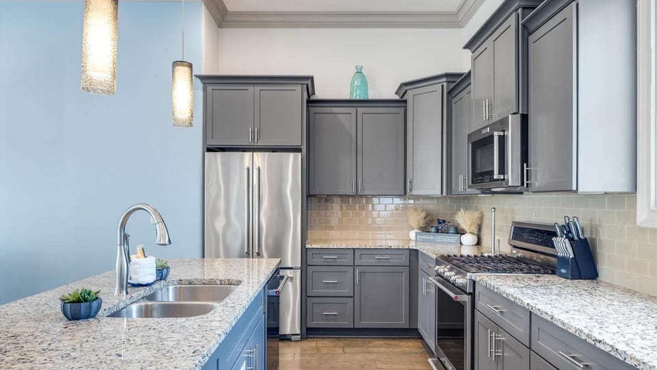 Spacious, fully equipped kitchen opens to the dining and living areas — perfect for cooking and connecting.