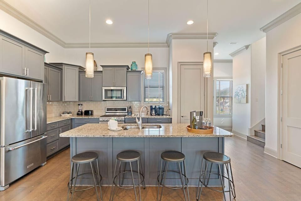 Cook, dine, and relax together in this open-concept kitchen that flows seamlessly into the living area.