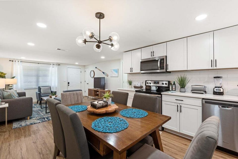 The dining space is nestled right in the kitchen and by living room.