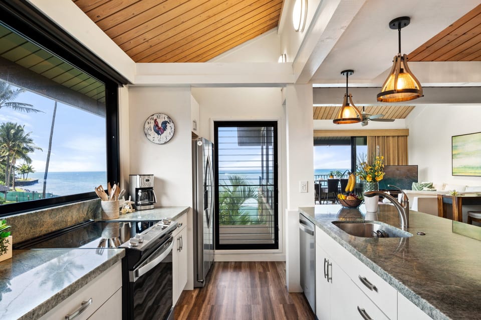 Enjoy a bright, open kitchen with sleek countertops, stylish lighting, and a seamless connection to outdoor beauty.
