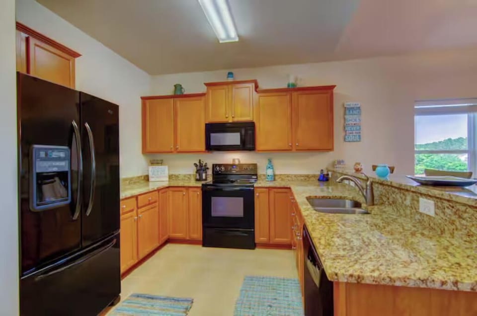 Full kitchen with granite countertops and modern appliances