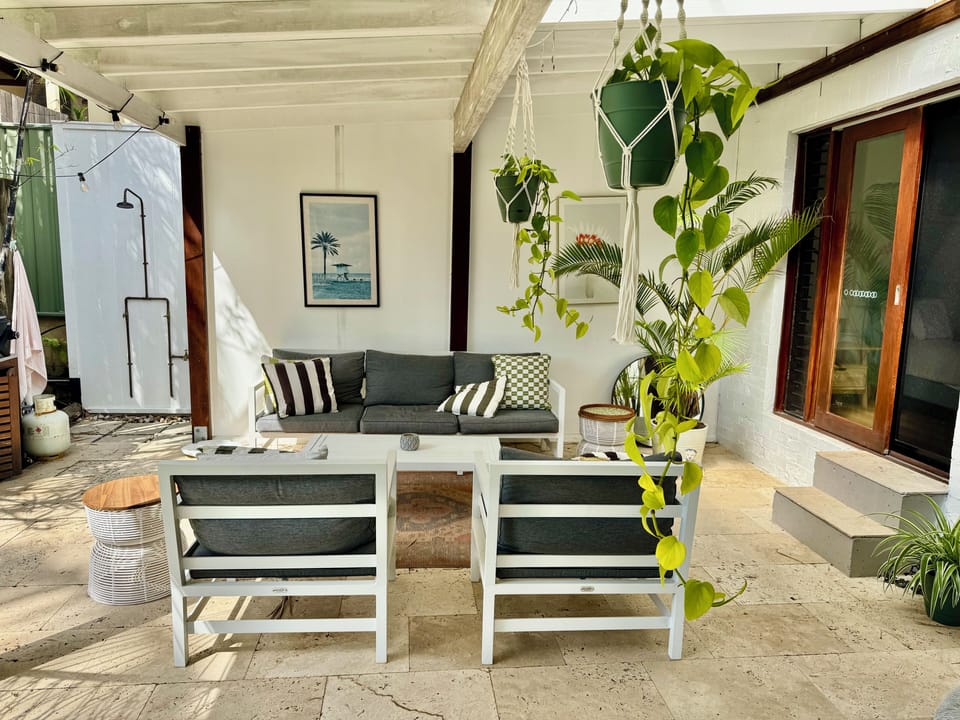 Kitchen & master open to a lush patio oasis - BBQ sizzling, hammock swaying