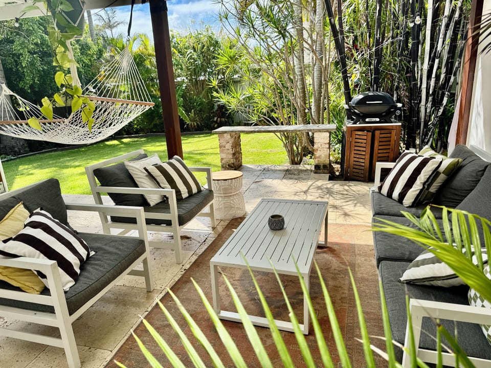 Kitchen & master open to a lush patio oasis - BBQ sizzling, hammock swaying