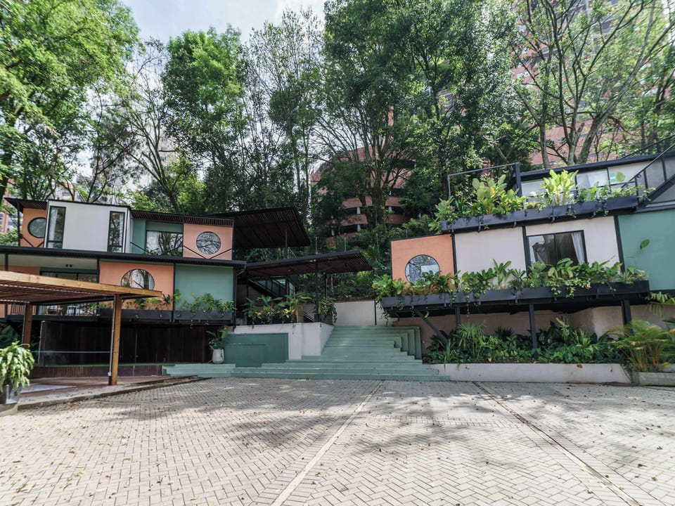 General view of the facade among trees