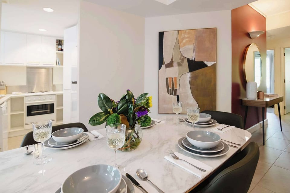 A spacious dining area with a six-seater table, ideal for family dinners or relaxed brunches.