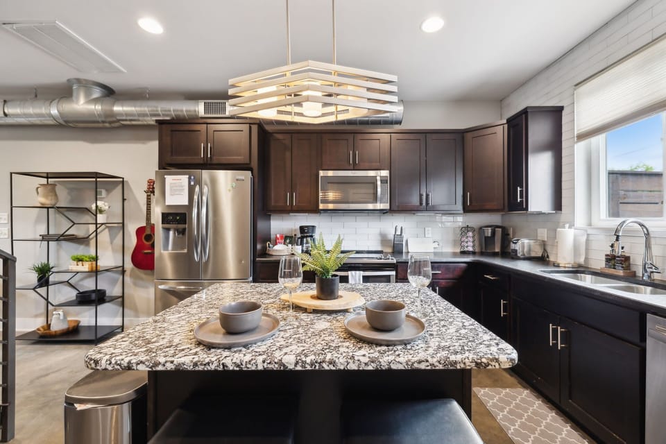 Kitchen: Whip up meals with ease—spacious counters and a central island made for cooking and conversation."