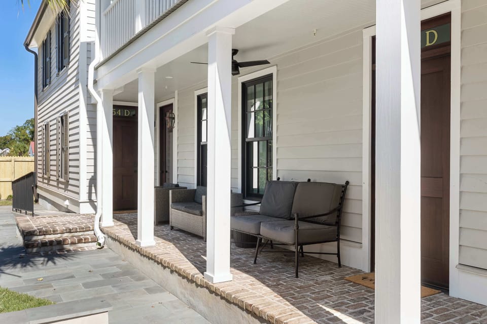 Shared porch seating, perfect for enjoying Charleston's charm and fresh air.